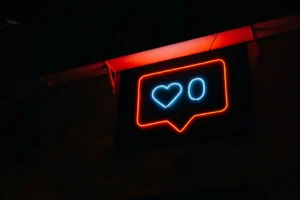 Bright neon heart icon with - Credits: pexels