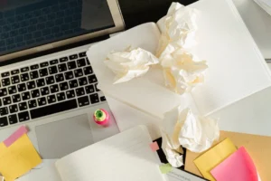 A cluttered desk with laptop, - Credits: pexels