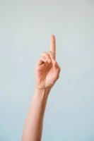 A single hand gesturing upwards - Credits: pexels