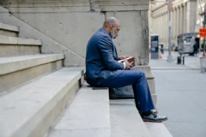 A professional man sits on - Credits: pexels
