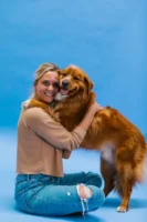 A woman joyfully hugs her - Credits: pexels