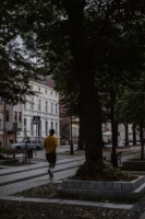 Person jogging through an urban - Credits: pexels