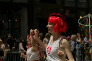 Vibrant street parade in New - Credits: pexels