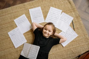 Cheerful girl in black dress - Credits: pexels