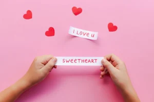 Hands holding love notes on - Credits: pexels