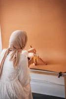 Muslim woman photographing cosmetic products - Credits: pexels