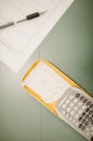 Closeup of a calculator with - Credits: pexels