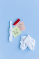 Pregnancy announcement with a positive - Credits: pexels