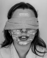 Black-and-white portrait of blindfolded woman - Credits: pexels