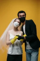 A couple wearing face masks - Credits: pexels
