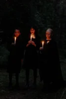 Three individuals in dark attire - Credits: pexels