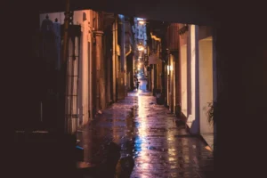 A moody alleyway with wet - Credits: pexels