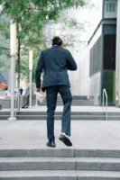 Rear view of a businessman - Credits: pexels