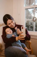 Joyful mother and baby capturing - Credits: pexels