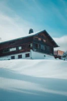 Wooden chalet blanketed in snow - Credits: pexels
