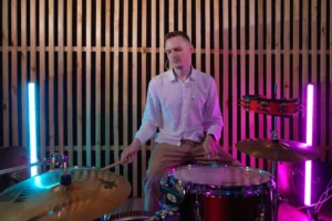 A male drummer plays passionately - Credits: pexels