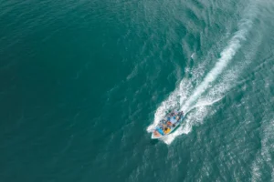 Aerial view of boat with - Credits: pexels