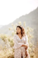 A smiling woman in a - Credits: pexels