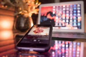 Modern workspace featuring a smartphone - Credits: pexels