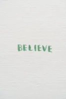 Green text 'BELIEVE' on textured - Credits: pexels