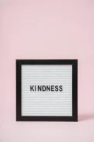 Framed message board with 'Kindness' - Credits: pexels