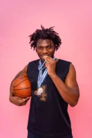 African American basketball player proudly - Credits: pexels