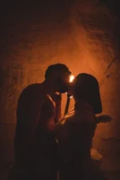 Silhouetted couple sharing a kiss - Credits: pexels