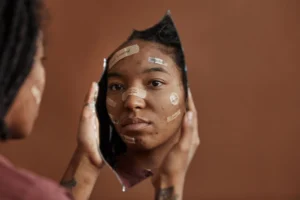 African American woman with Band-Aids - Credits: pexels