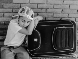 Young boy in cap rests - Credits: pexels