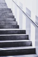 A contemporary concrete staircase with - Credits: pexels