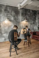 A young boy learning guitar - Credits: pexels