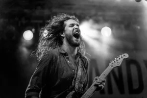 Expressive guitarist passionately performing live - Credits: pexels