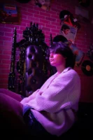 A woman sits elegantly on - Credits: pexels