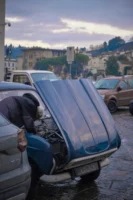 Mechanic fixing a car on - Credits: pexels