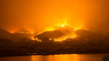 Intense wildfire blazing on hills, - Credits: pexels