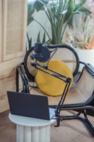 Modern laptop and microphone on - Credits: pexels
