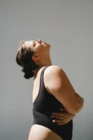 Confident plus size woman posing - Credits: pexels