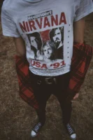 Person wearing a Nirvana t-shirt - Credits: pexels