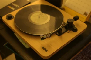 A classic wooden turntable playing - Credits: pexels