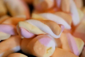 Close-up of colorful twisted marshmallow - Credits: pexels
