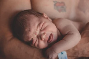 Tender moment of a newborn - Credits: pexels
