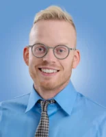 A confident and smiling man - Credits: pexels