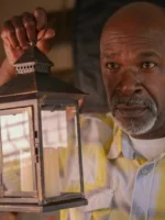 Senior man holding a lantern, - Credits: pexels