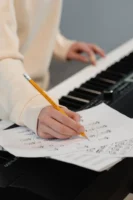 Creating music sheets while playing - Credits: pexels