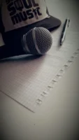 Microphone, pen, and graph paper - Credits: pexels